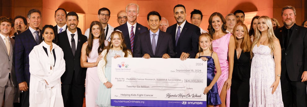 helping kids fight cancer foundation showing their big check from hyundai hope on wheels - South Shore Hyundai in Valley Stream NY